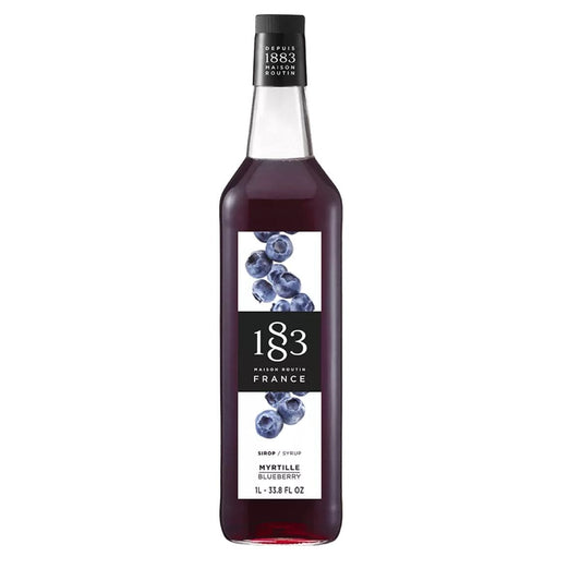 1883 Blueberry Sirup – elegant flaske med blåbærillustration, ideel til cocktails, mocktails og desserter.